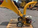 the small machine is sitting on a pallet in a warehouse