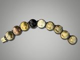 a close up of a beaded bracelet with different colored beads