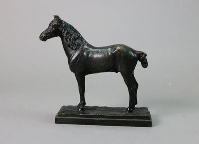 bronze statue of a horse on a black base on a white background