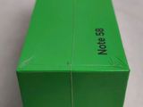 a green box that is open on a white surface