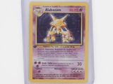 a close up of a pokemon card on a white surface