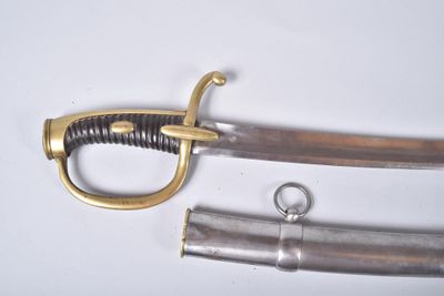 two swords that are laying next to each other on a table