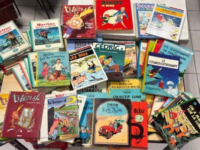 many children ' s books sitting on a table together