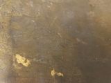 a close up of a metal surface with a lot of scratches