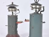 two old fashioned stoves that are sitting side by side