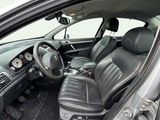 a picture of the interior of a car with leather seats
