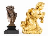 two statues that are sitting next to each other