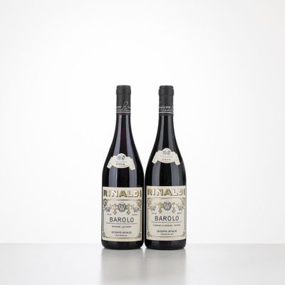 two bottles of wine sitting on top of a table next to each other