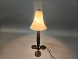 a lamp that is sitting on a table next to a lamp