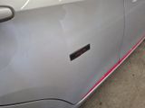 the door handle of a car with a sticker on it