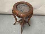 a small wooden table with a clock on top of it