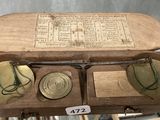an old wooden box that has a lot of things inside of it