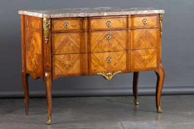a marble top chest of drawers with a marble top