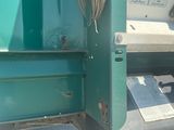 an image of a green truck with its door open