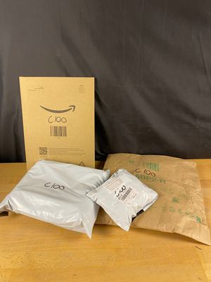 two bags of coffee sitting on a table next to a bag of coffee