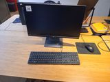 a desktop computer sitting on a desk with a keyboard and mouse