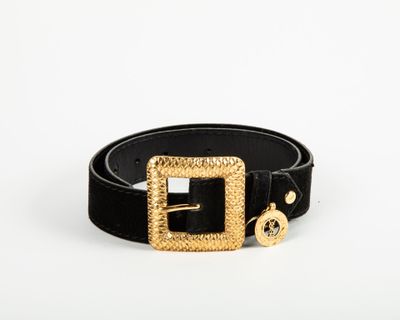 a black belt with a gold buckle and a gold buckle