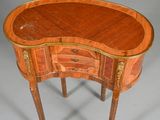 an image of a small wooden table with a drawer on it