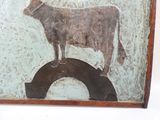 un tableau représentant une vache debout sur un morceau de bois