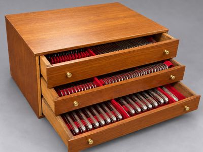 an image of a wooden box with a drawer full of silverware