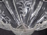 a glass bowl that has a flower design on it