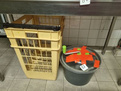 a trash can sitting next to a trash can on the floor