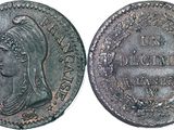 a silver coin with a woman ' s head and a crown on it