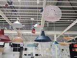 many lamps hanging from the ceiling in the room