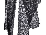 two pieces of black lace are hanging on a clothes line