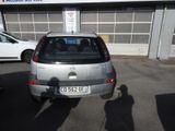 a silver car parked in front of a building
