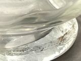 a close up of a glass vase on a table