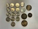 a close up of a bunch of coins sitting on top of a table