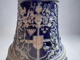 a blue and white vase with a lion on it