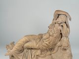 marble statue of a reclining woman reclining on a rock