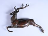 statue of a deer with antlers on it ' s back legs