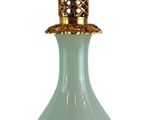 a glass lamp that is sitting on a stand