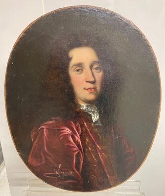 portrait of a man in a red coat and a white collared shirt