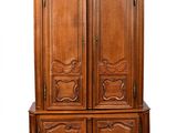 an image of a wooden armoire with carvings on it