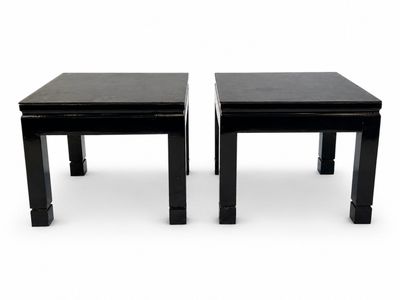 pair of black side tables on white background