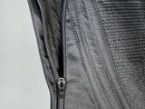 an image of a black corset with zippers on it