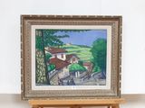 a picture of a painting on a easel in a room