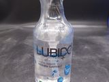 a bottle of liquid sitting on a counter top