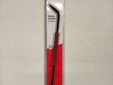 a red and black toothbrush in a plastic package