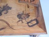 a wooden table with a floral design on it