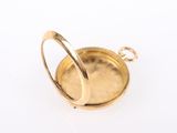 an image of a close up of a gold plated object on a white surface