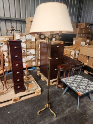 a lamp that is sitting on a table in a room