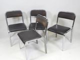 three chairs and a stool are sitting in a row on a white surface