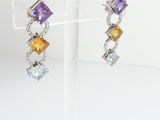 two tone earrings with amethorate, citrine, and citrine stones