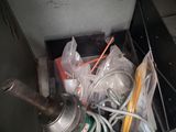 a metal box with a bunch of items inside of it