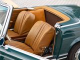 a close up of a green car with leather seats